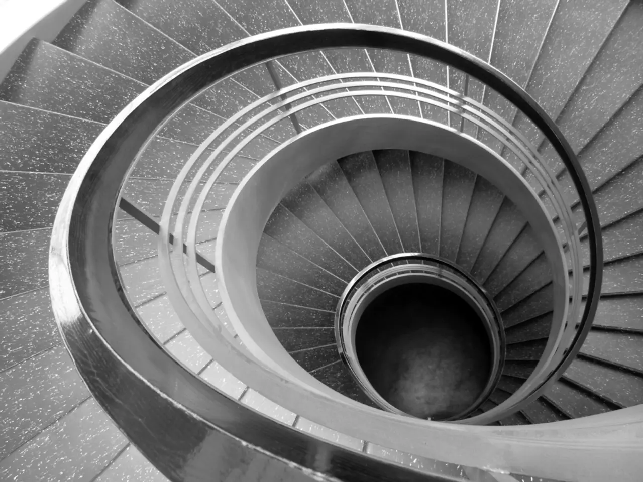 In this image we can see staircase with railing.