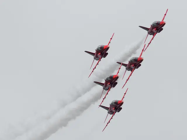 In this image we can see a group of airplanes flying in the sky.