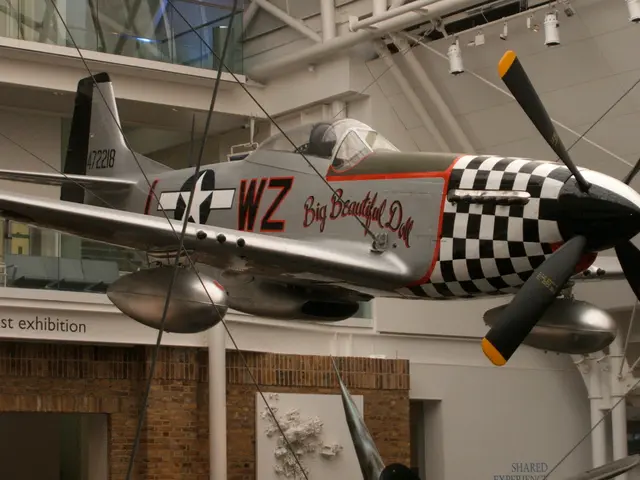 In this image we can see an airplane tied with cables inside a building. In the background, we can...