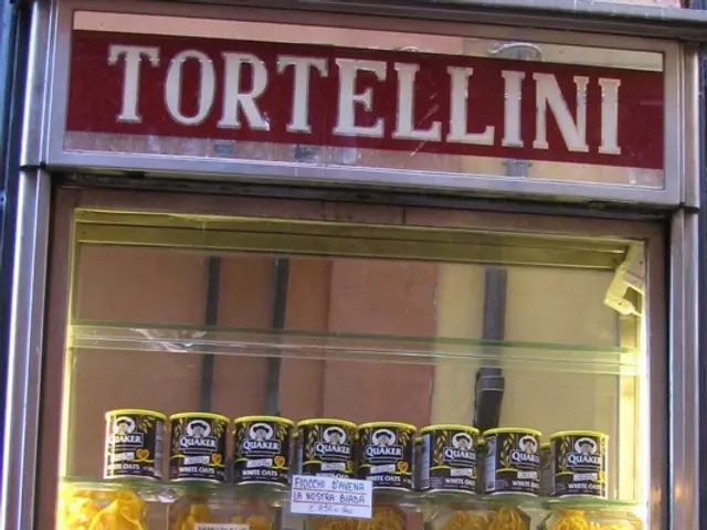 In this image I can see a refrigerator. There are some bottles and packets are placed.