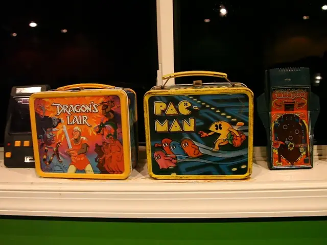 In this image, we can see gadgets and boxes in front of the window.