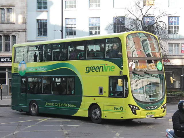 In this image there is a bus is on the road in the middle of this image. there are some buildings...